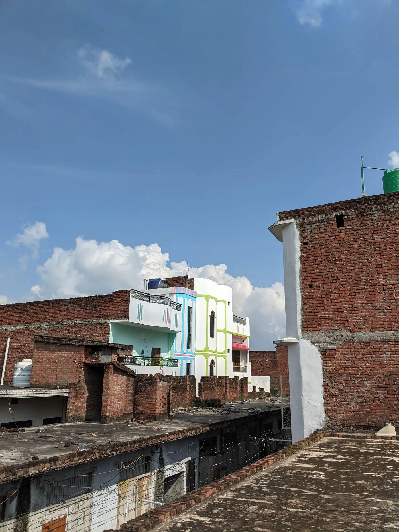 Flat brick rooftops and water tanks on neighbouring houses