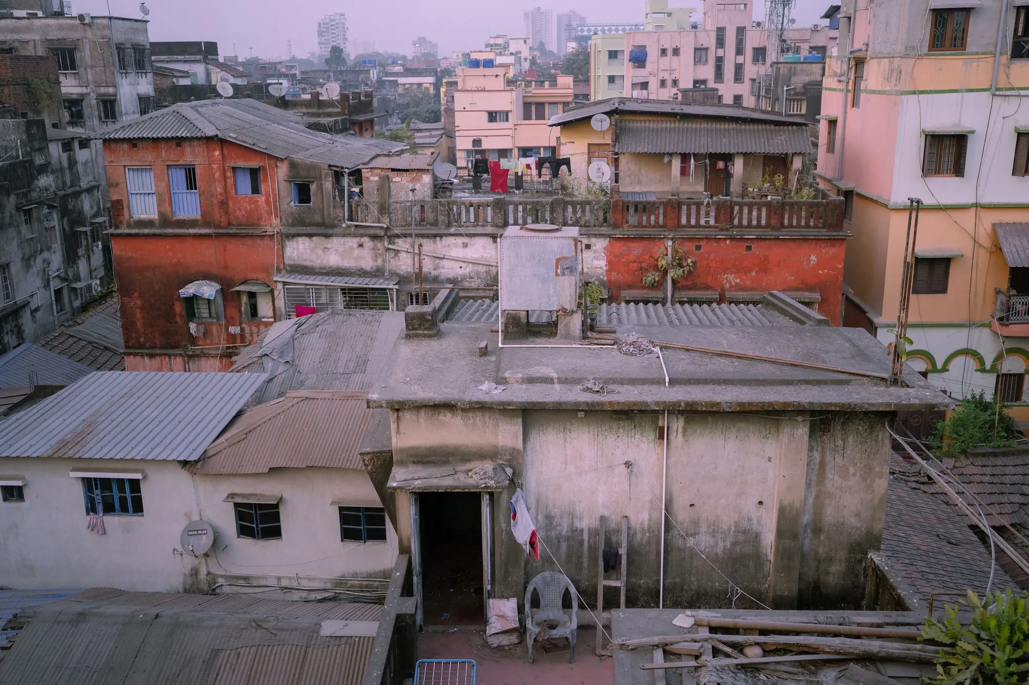 Crowded rooftops and terraces across a Kolkata neighbourhood